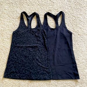 Lot of two lululemon Cool Racerback Tank Tops 
Nulu Size 6 Black and Black Camo